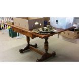 An oak drawer leaf dining table