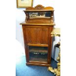 An Edwardian mahogany music cabinet