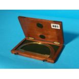 A mahogany cased brass protractor