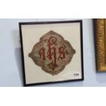 A piece of fabric from an Ecclesiastical robe, monogrammed 'I.H.S'