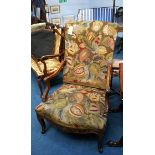 A late 19th century walnut armchair with scrolled arms and needlework back and seat, supported on