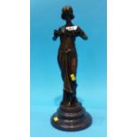 A modern bronze statue of a Classical lady