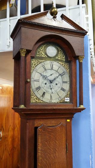 An oak cased 8 day long case clock, brass dial with subsidiary date and seconds dial, signed