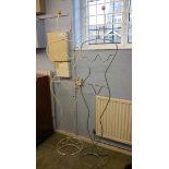 Pair of wire work valet stands in the form of fema
