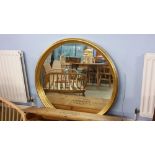 Large circular gilt mirror