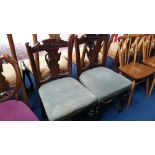 A pair of oak chairs