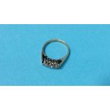 A 9ct gold three stone diamond ring