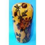 A tall Madras ware vase decorated with autumnal le