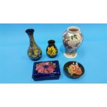 A collection of five pieces of Moorcroft pottery