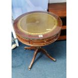 A reproduction mahogany drum table