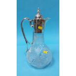 A cut glass claret jug with silver plated mounts