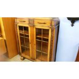 A carved oak china cabinet