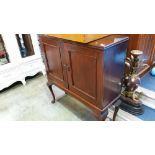 A mahogany 2 door cabinet on cabriole legs