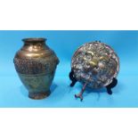 A Chinese bronze vase and a brass dinner gong lion