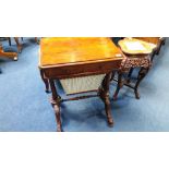 A Victorian yew wood sewing table with single drawer and fitted interior and pierced fretwork sides,