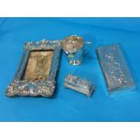 Assorted silver including a cup, cigarette box, trinket box and a picture frame