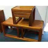 Teak nest of tables and a teak coffee table