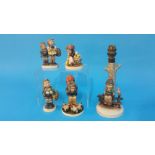 Four Hummel figures and a table lamp