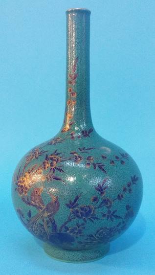 A Chinese vase with waisted neck, the baluster body decorated with birds sitting on branches,