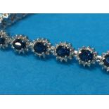 An 18ct white gold (stamped '750') diamond and sapphire bracelet