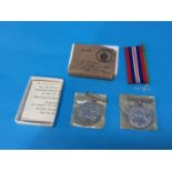 Pair of unnamed World War II medals, with box, ribbons and some paperwork