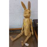 A wooden articulated rabbit