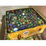 Tin of marbles