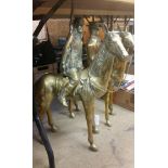 Two large brass figures on horseback