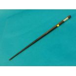 A white metal mounted conductors baton