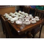 Oak drawer leaf table and four chairs