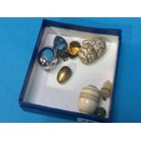 A collection of various eggs including Ivory, mother of pearl etc.