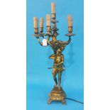 A gilt metal table lamp of a Cherub holding aloft a seven sconce acanthus branch