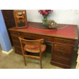 A mahogany pedestal desk