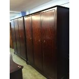 A pair of Stag triple door wardrobes