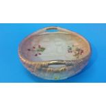 A Royal Worcester two handled basket with gilt handles and decorated with flowers, green printed
