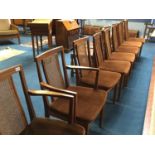 A set of eight teak dining chairs, with 6 single and 2 carver chairs