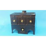 A small late 19th century early 20th century cast French child's stove, 37cm wide