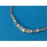 An 18ct white gold pearl and diamond necklace, approx 0.7ct