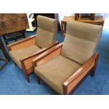 A pair of teak armchairs