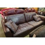 Two brown leather settees