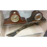 Two Mantle clocks and golf clubs