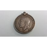 A World War I medal awarded to George Thomas Cooper, 2nd Northumbrian Field Ambulance Royal