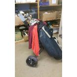 Set of golf clubs with a trolley