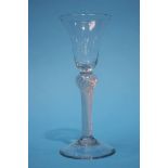 A Georgian wine glass with bell shaped bowl and clear air twist inverted baluster stem. 15.5cm