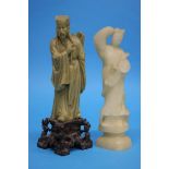 Two Oriental soapstone carved figures.