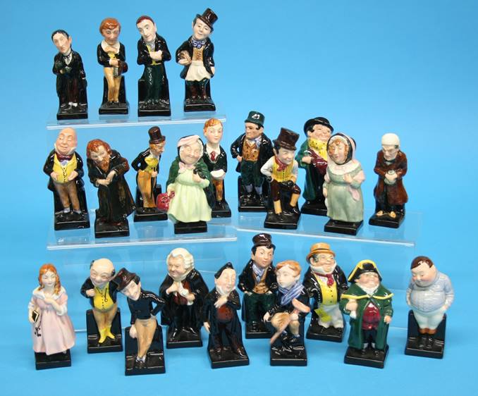 A set of twenty four Royal Doulton Dickens figures