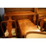 A walnut six piece dining room suite