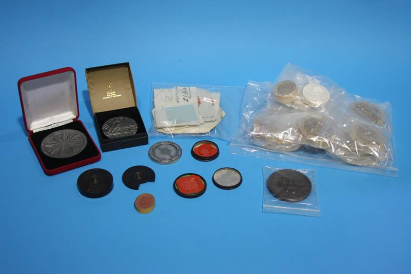 A tin box containing a quantity of various seals