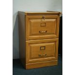 A reproduction two drawer filing cabinet