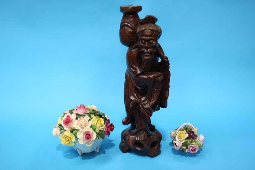 An Oriental carved rootman figure and two posy holders